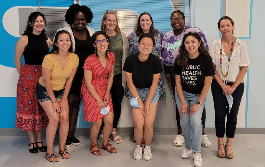 Group of diverse smiling young women posed for camera