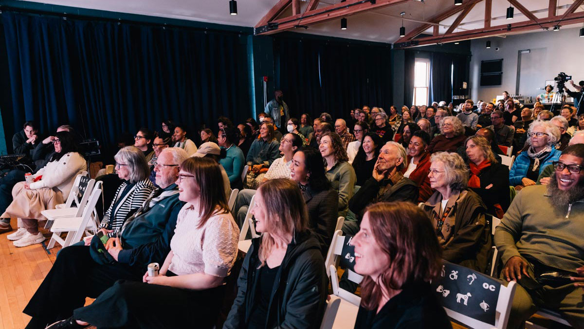 An attentive crowd sits, listening to speakers at Chicago’s 2026 Spring Humanities Fest. 