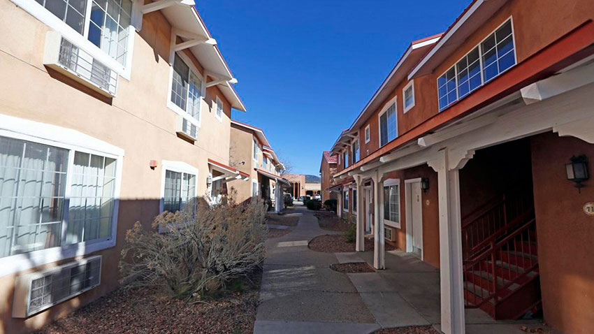 apartment building with sidewalk