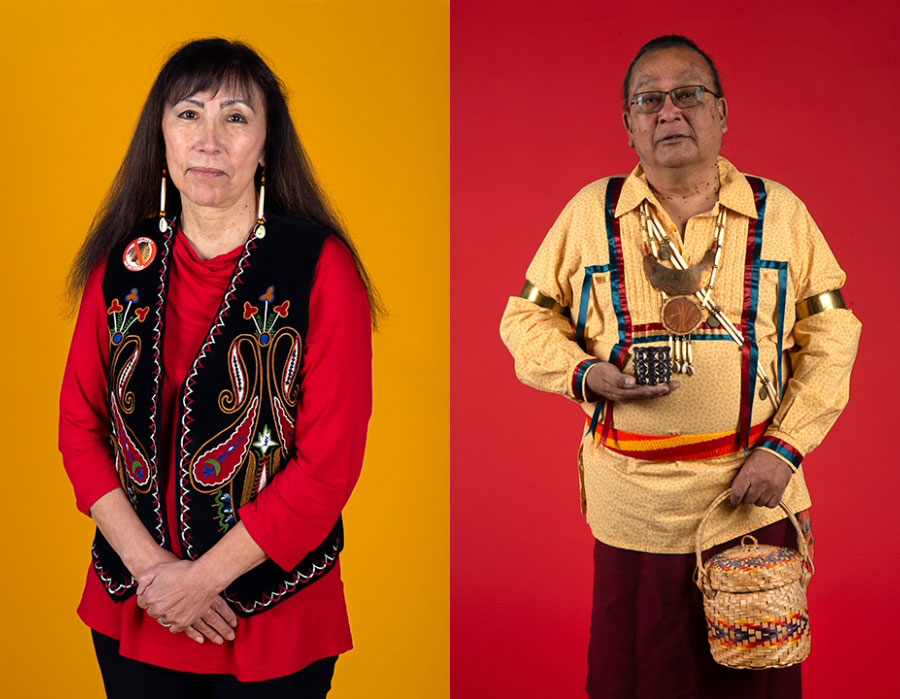 Two people in traditional attire stand against yellow and red backgrounds. The left wears beaded clothing, the right holds a basket.